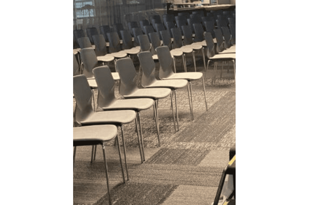 A row of chairs in an empty room.
